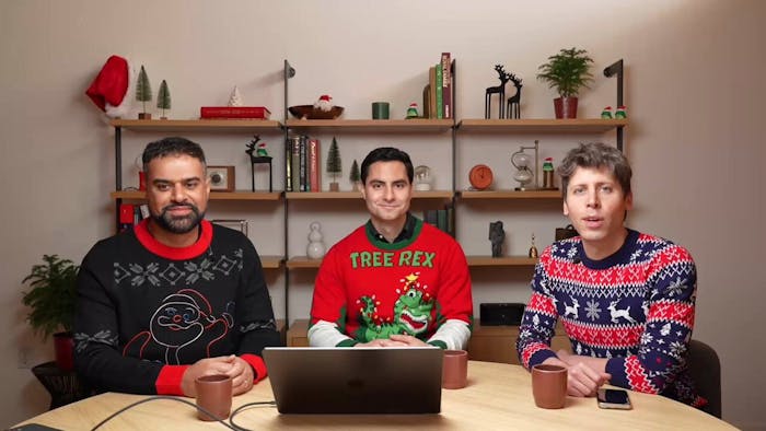 Sam Altman and engineers from OpenAI sitting around a table